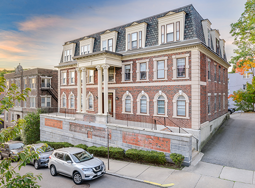 19 Bellvista building with cars parked along street